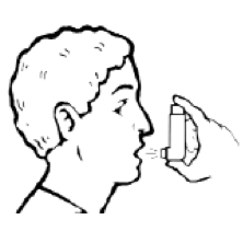 Man holding a metered dose inhaler up to and in front — but not in — his mouth.